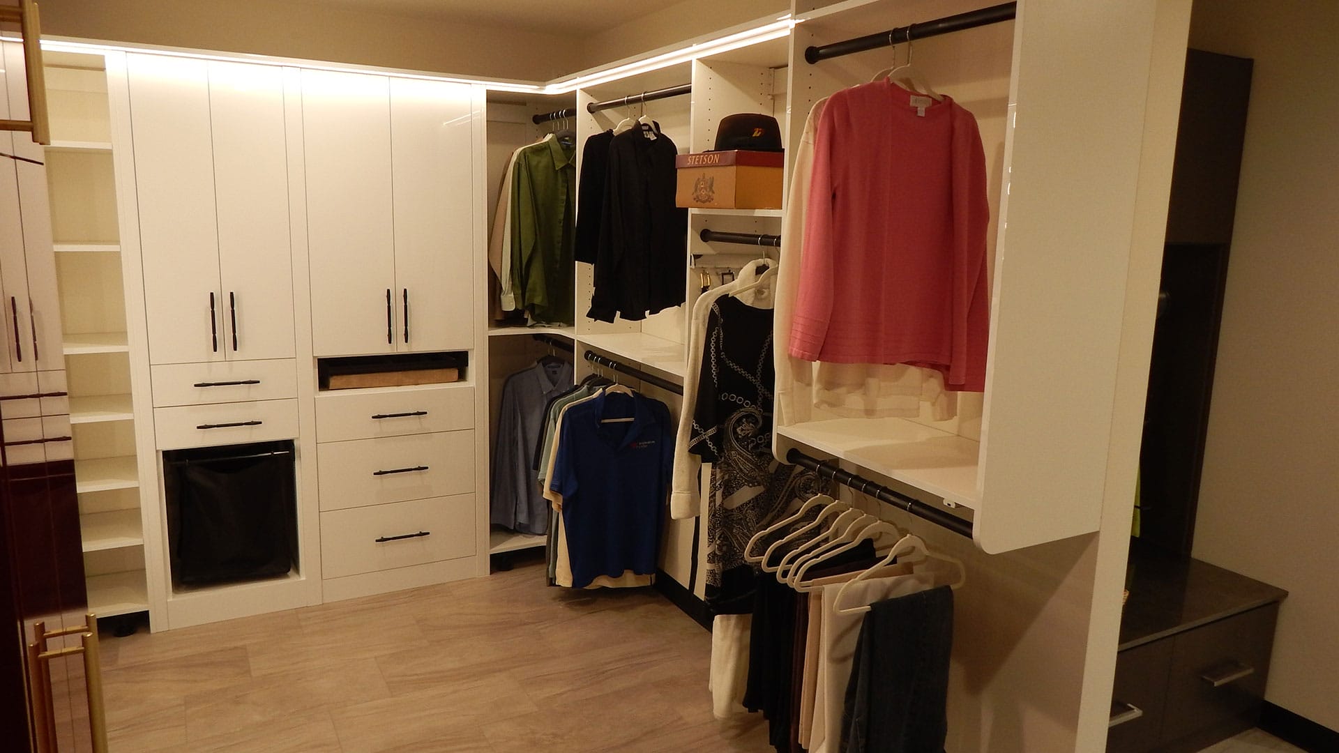 Custom walk-in closet design and installation by Gulfshore Closets in Naples, FL, showcasing organized storage and expert craftsmanship.